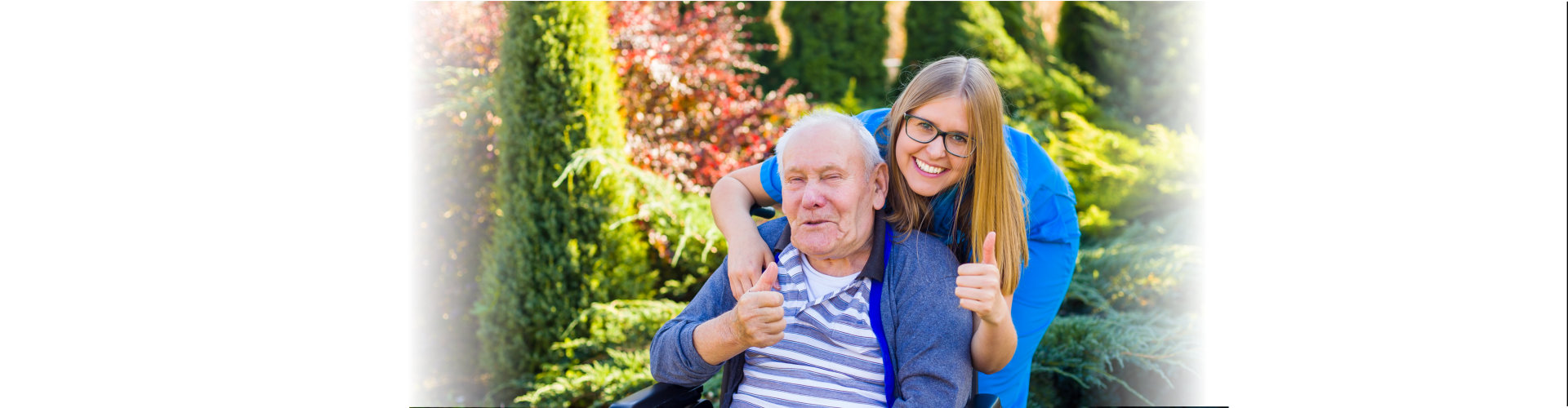 woman caregiver and elderly woman doing thumb up