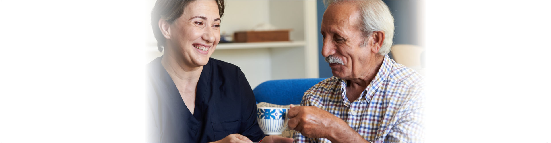 woman caregiver assisting the elderly man