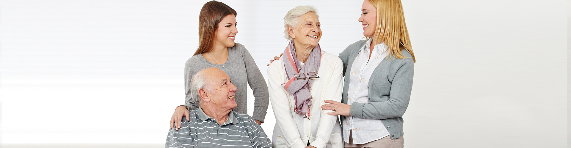 two caregivers with the two elderly persons